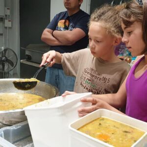 Angela Lee Right Cubs cooking for a homeless shelter